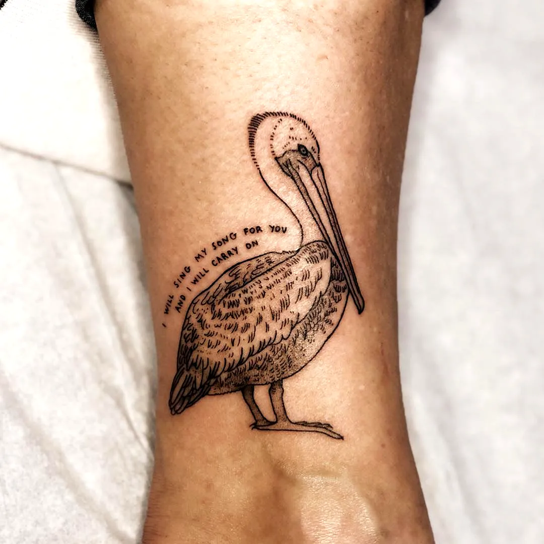 Pelican Arm Tattoo with Whimsical Text