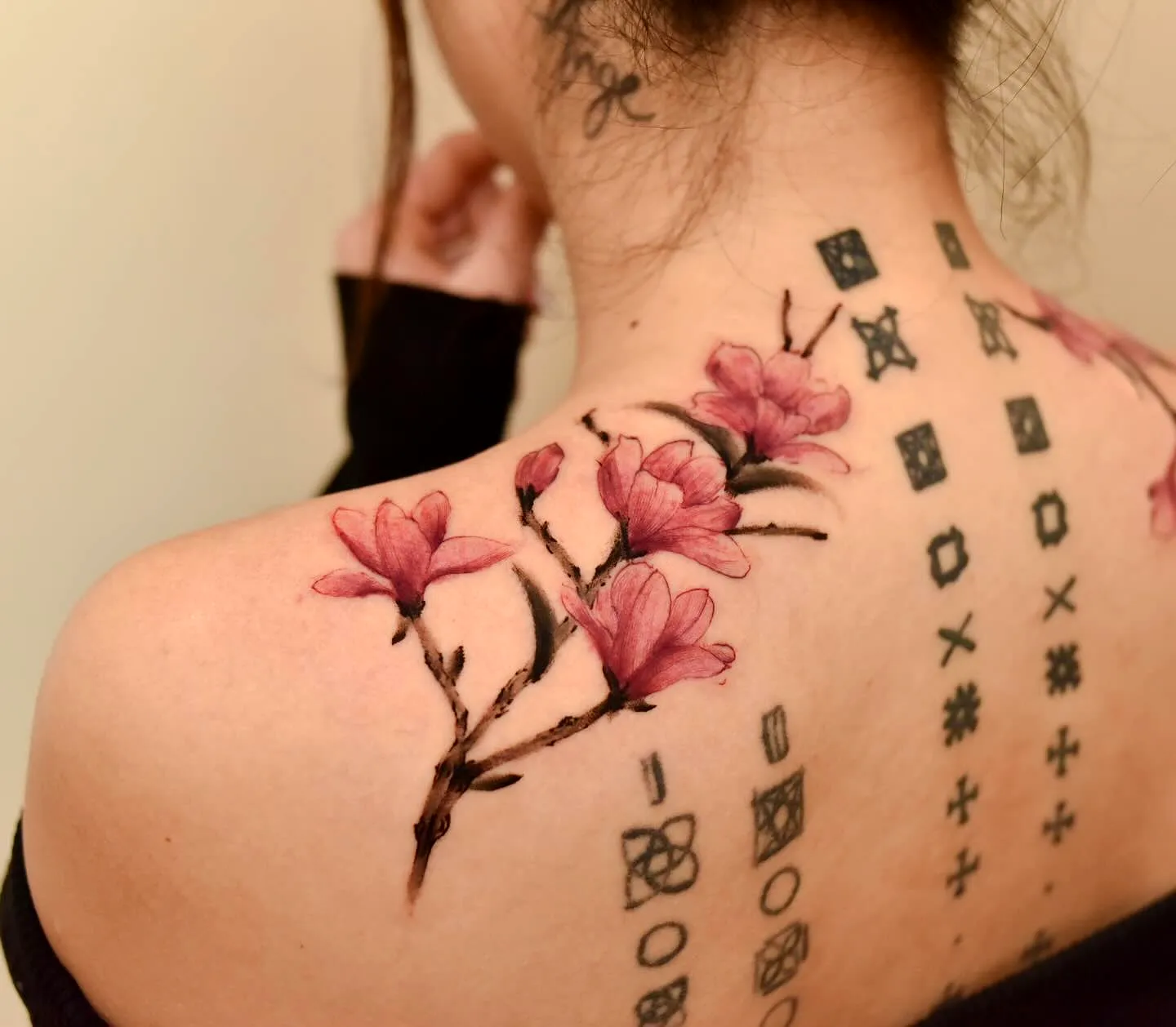 Pink Flower Upper Back Tattoo Design