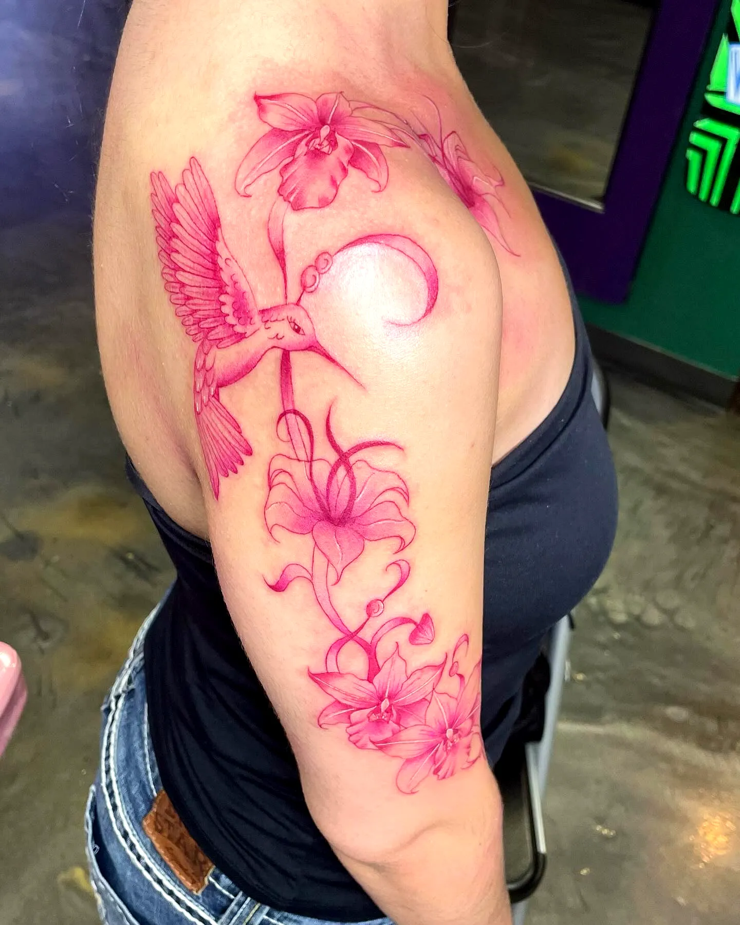 Pink Hummingbird Arm Tattoo with Orchids