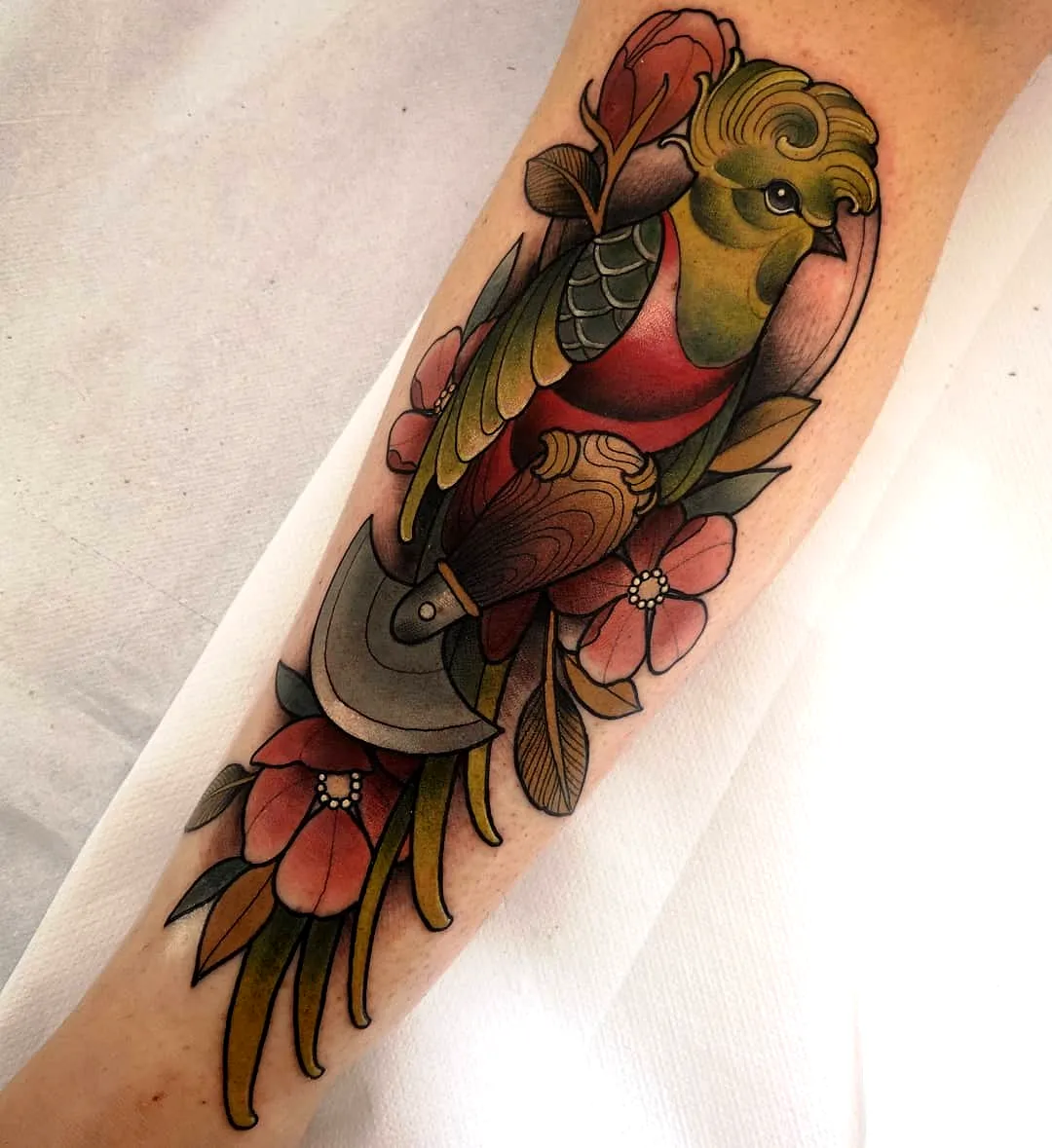 Quetzal Forearm Tattoo with Flowers