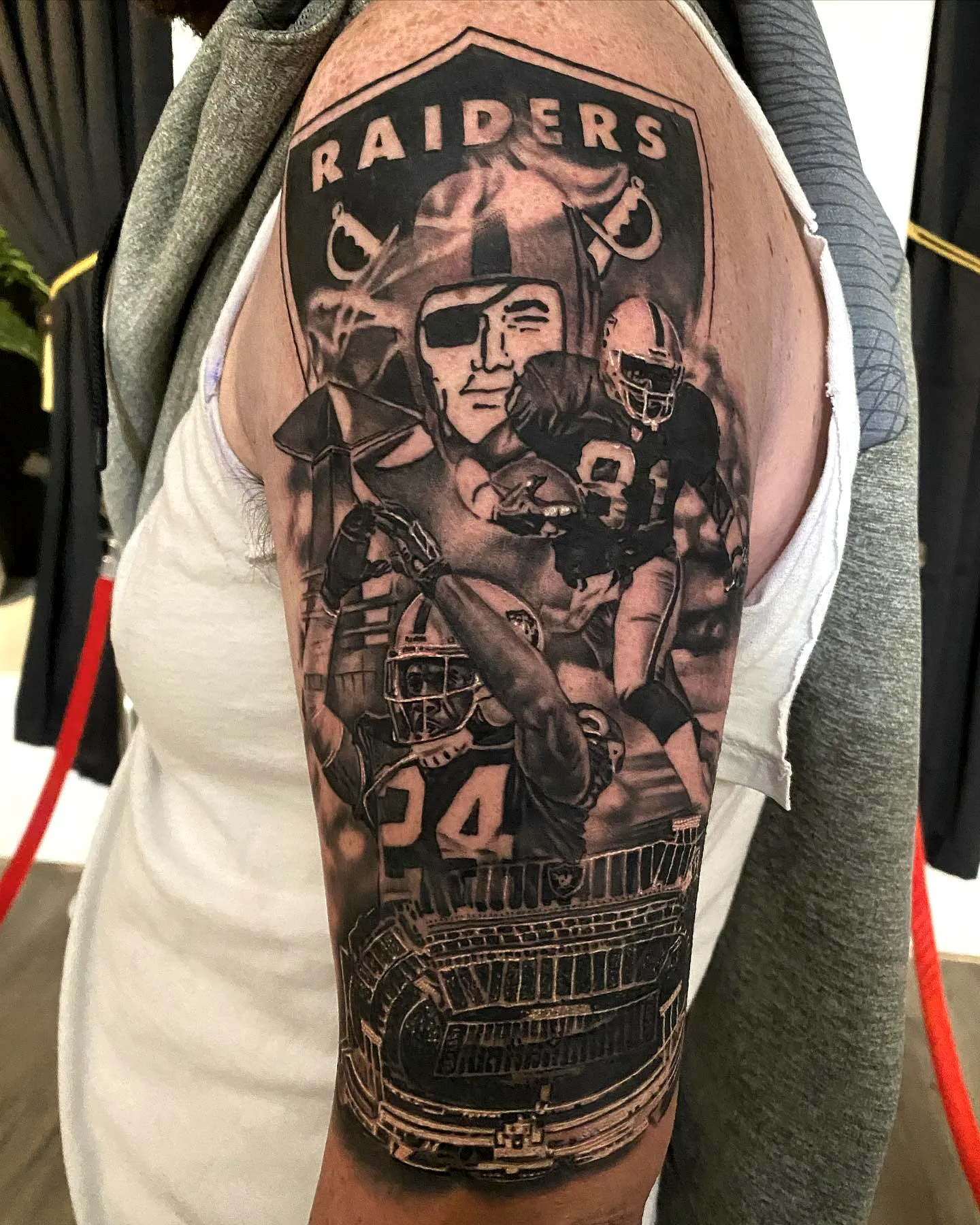 Raiders Black and Gray Arm Tattoo