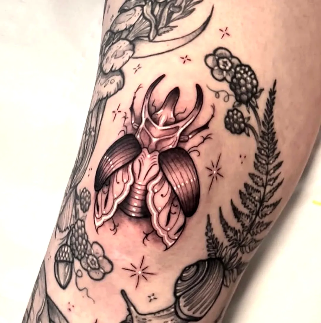 Realistic Beetle Arm Tattoo with Flowers