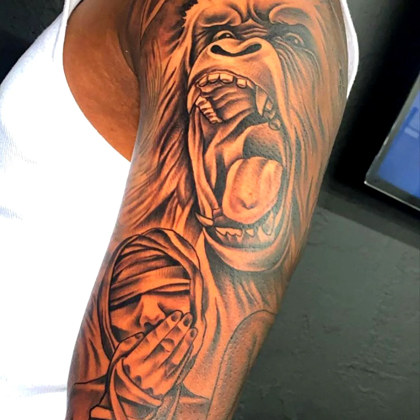 Realistic Gorilla Arm Tattoo in Black and Gray
