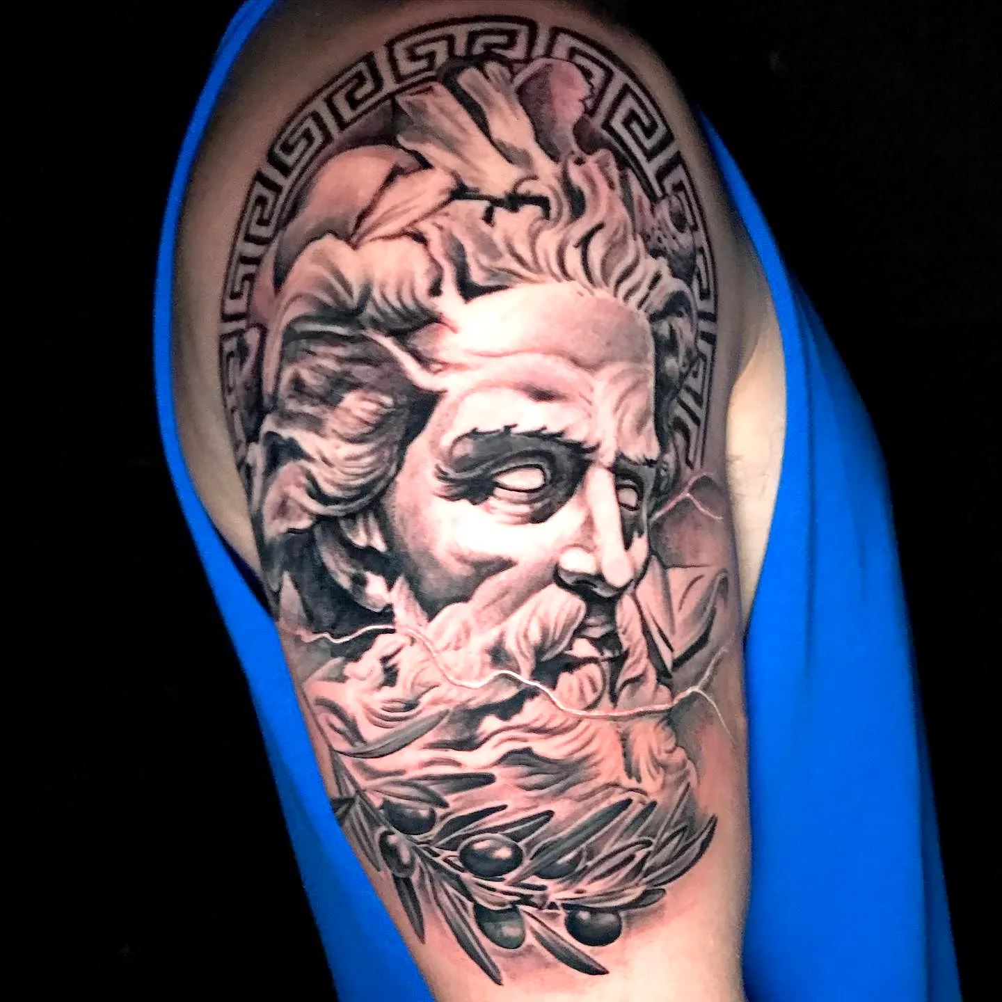 Realistic Greek deity upper arm tattoo