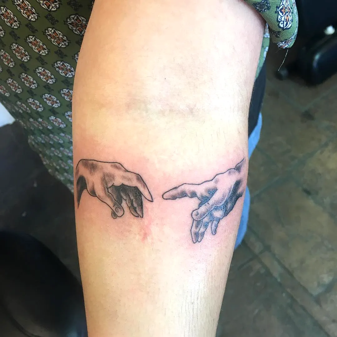 Realistic hands inner forearm tattoo