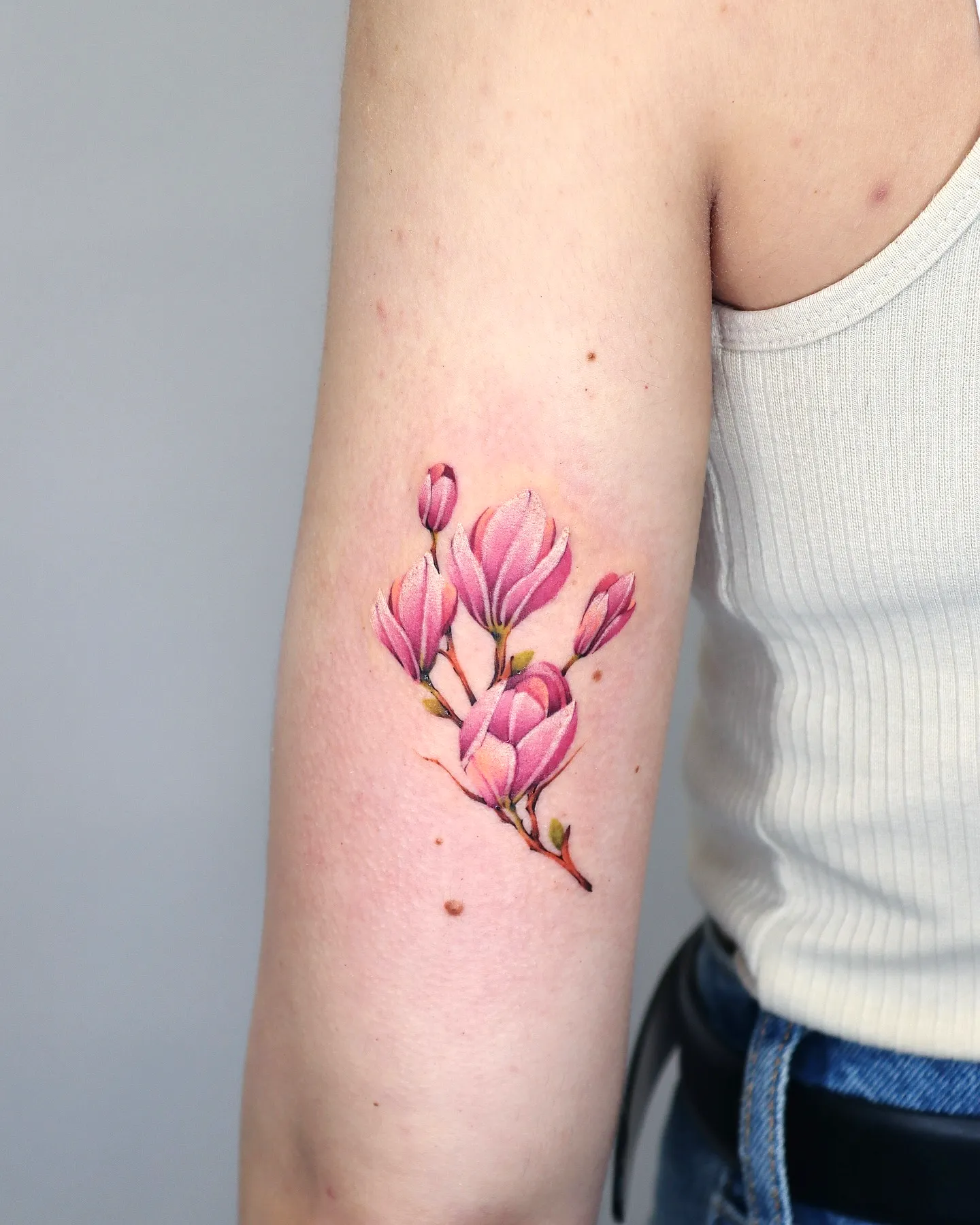 Realistic Magnolia Upper Arm Tattoo