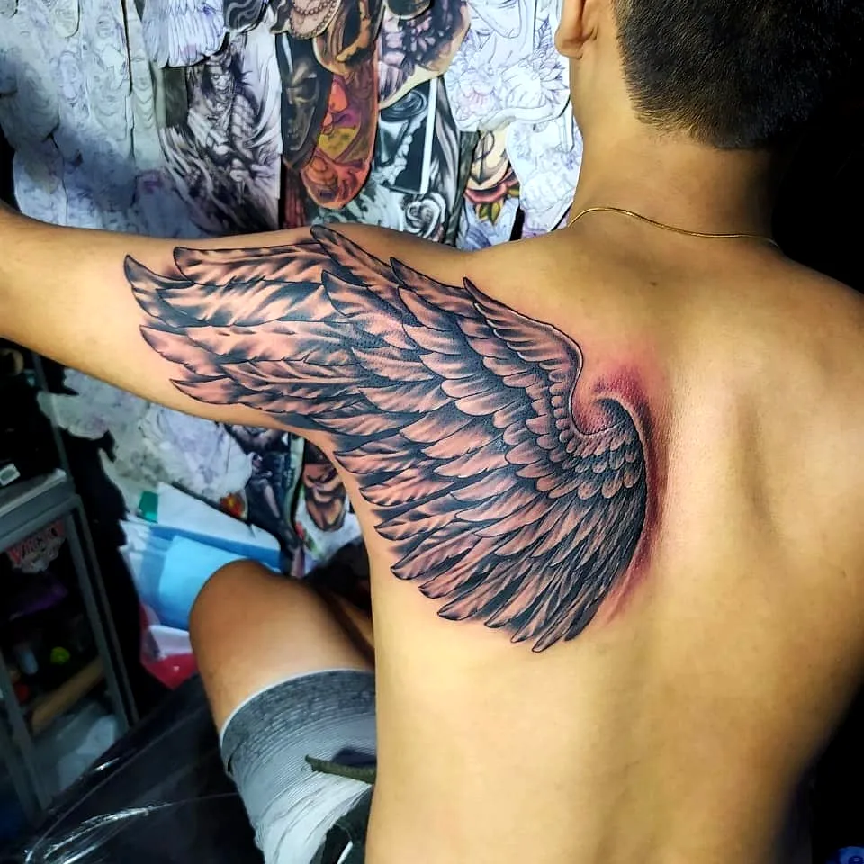 Realistic Wing Upper Back Tattoo