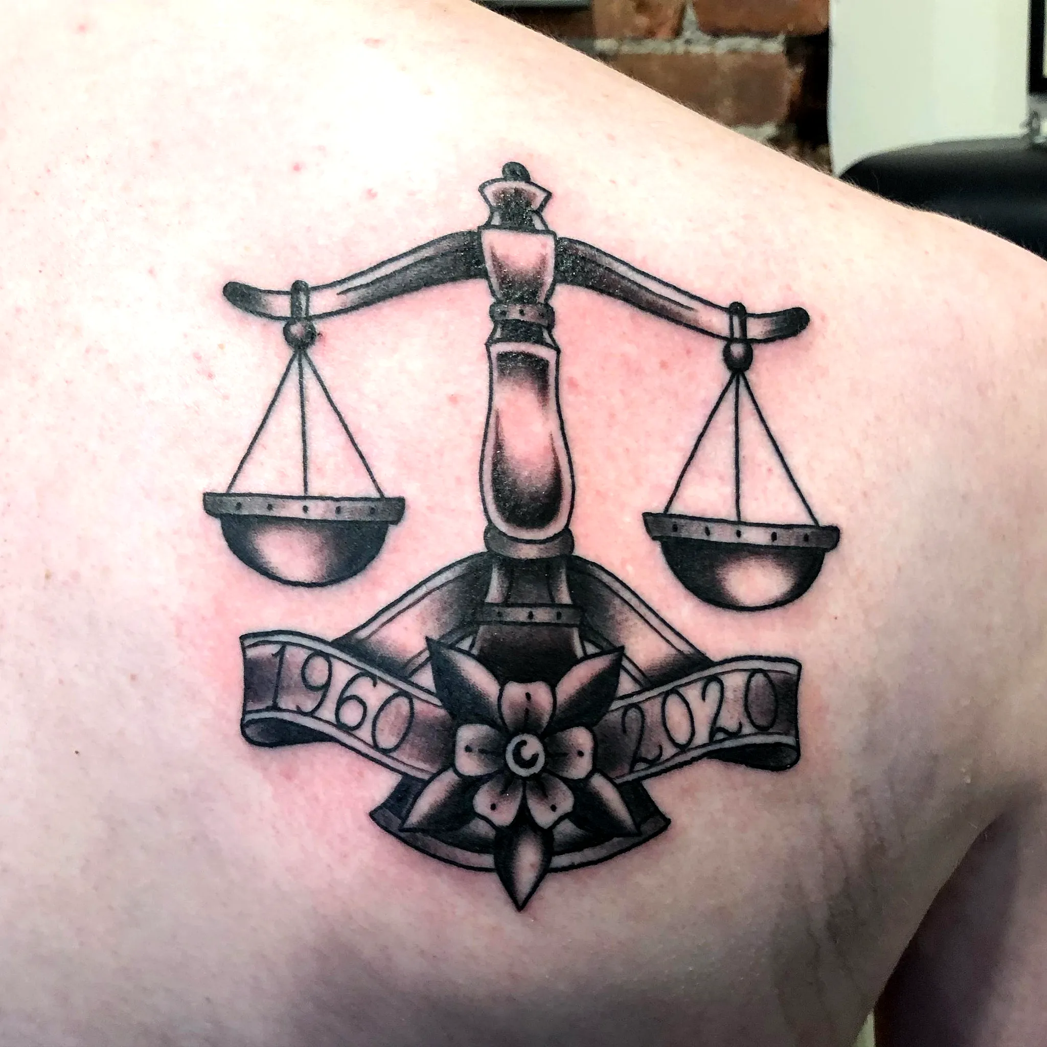 Scale Floral Arm Tattoo in Black Ink