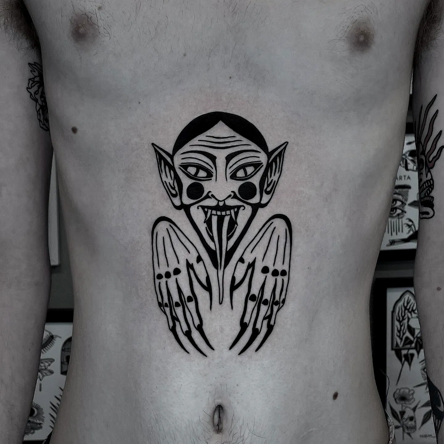 Sinister Creature Chest Tattoo
