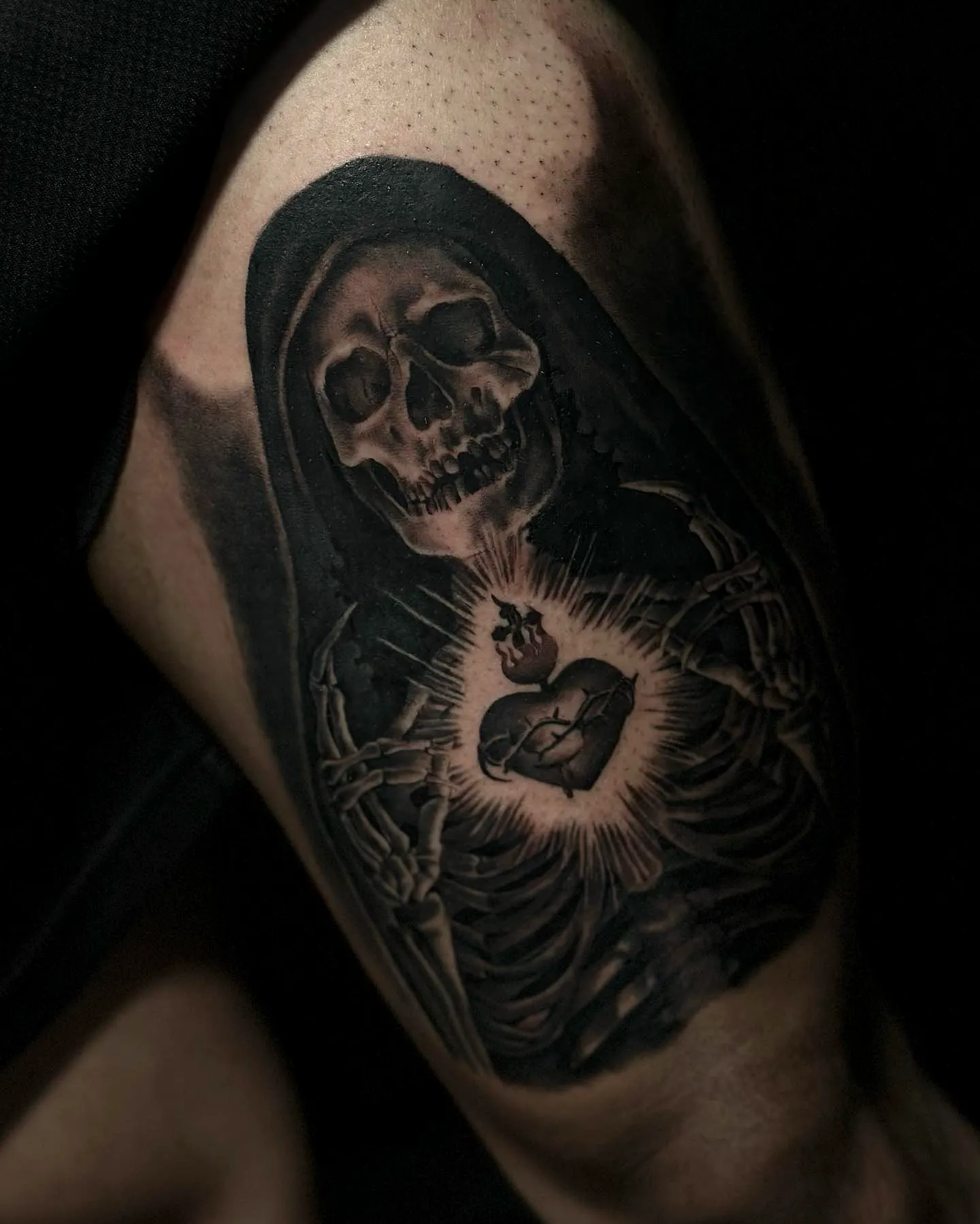 Skeletal Figure Forearm Tattoo in Black