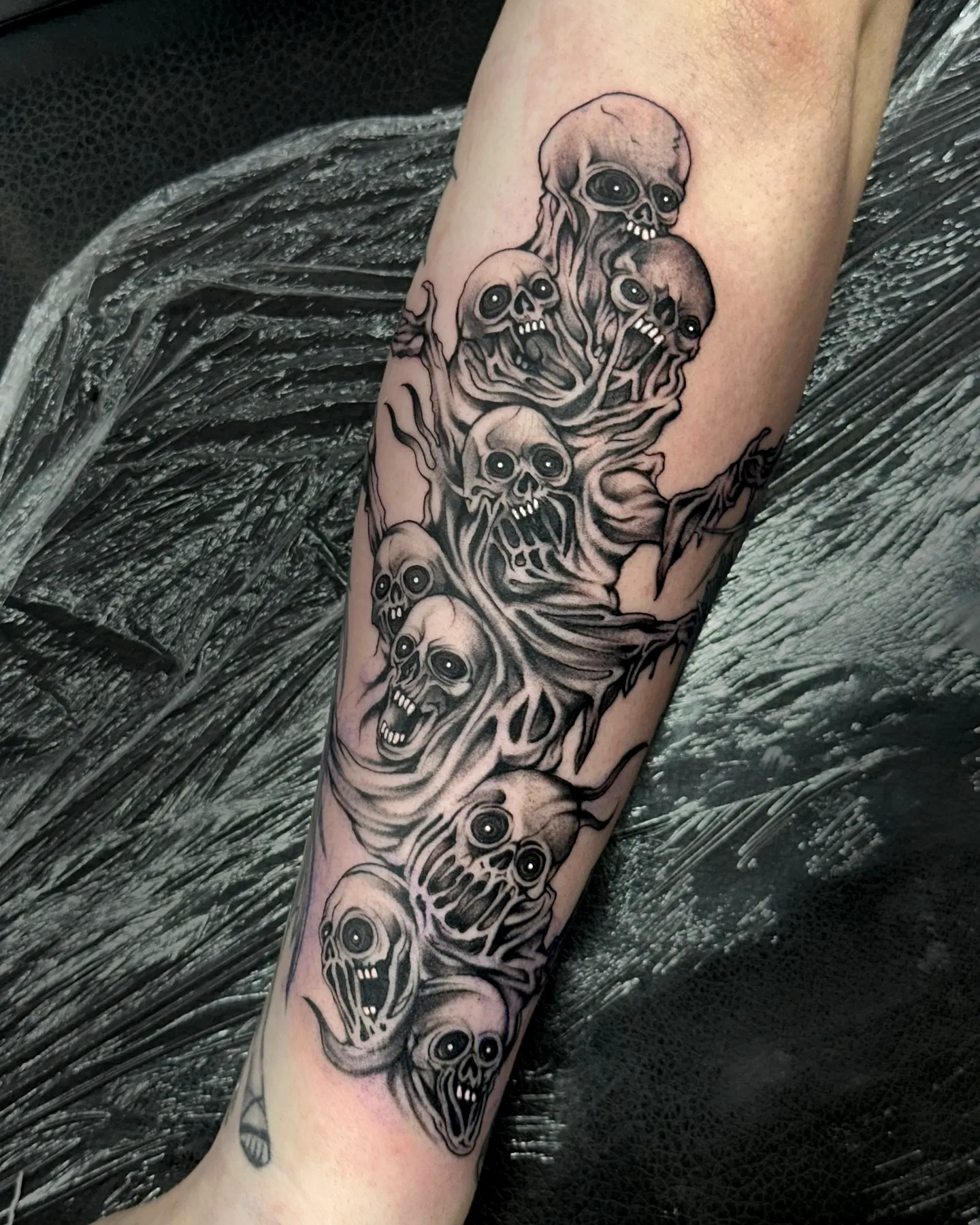 Skeletal Figures Forearm Tattoo