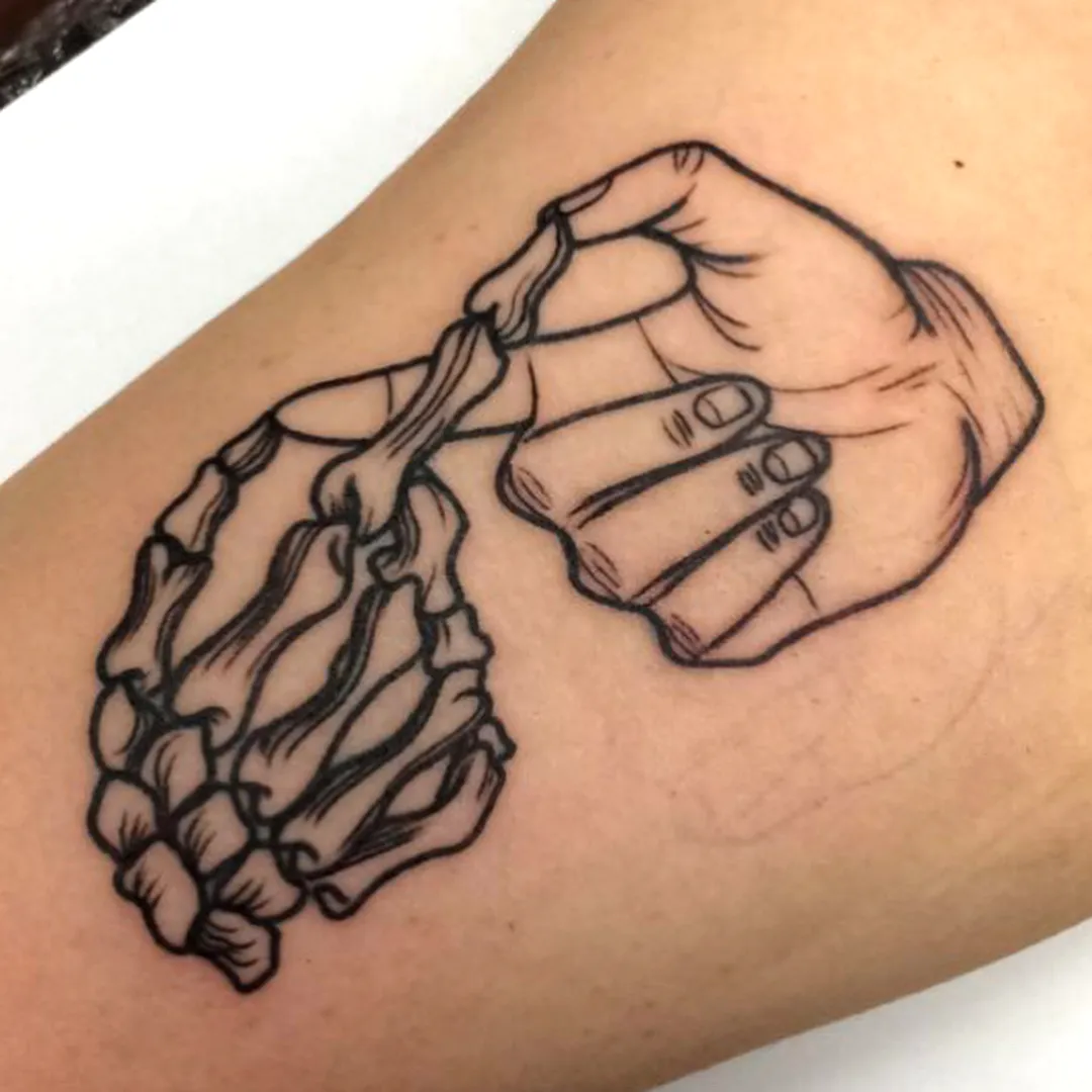 Skeletal Hand Outline Tattoo on Human Hand