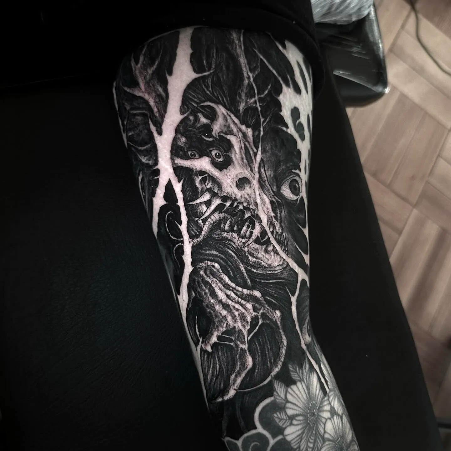 Skull Arm Tattoo with Ominous Elements