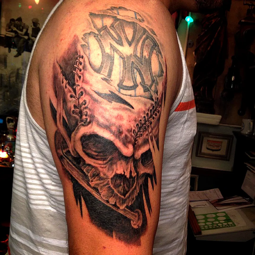 Skull Upper Arm Tattoo with Baseball Bats