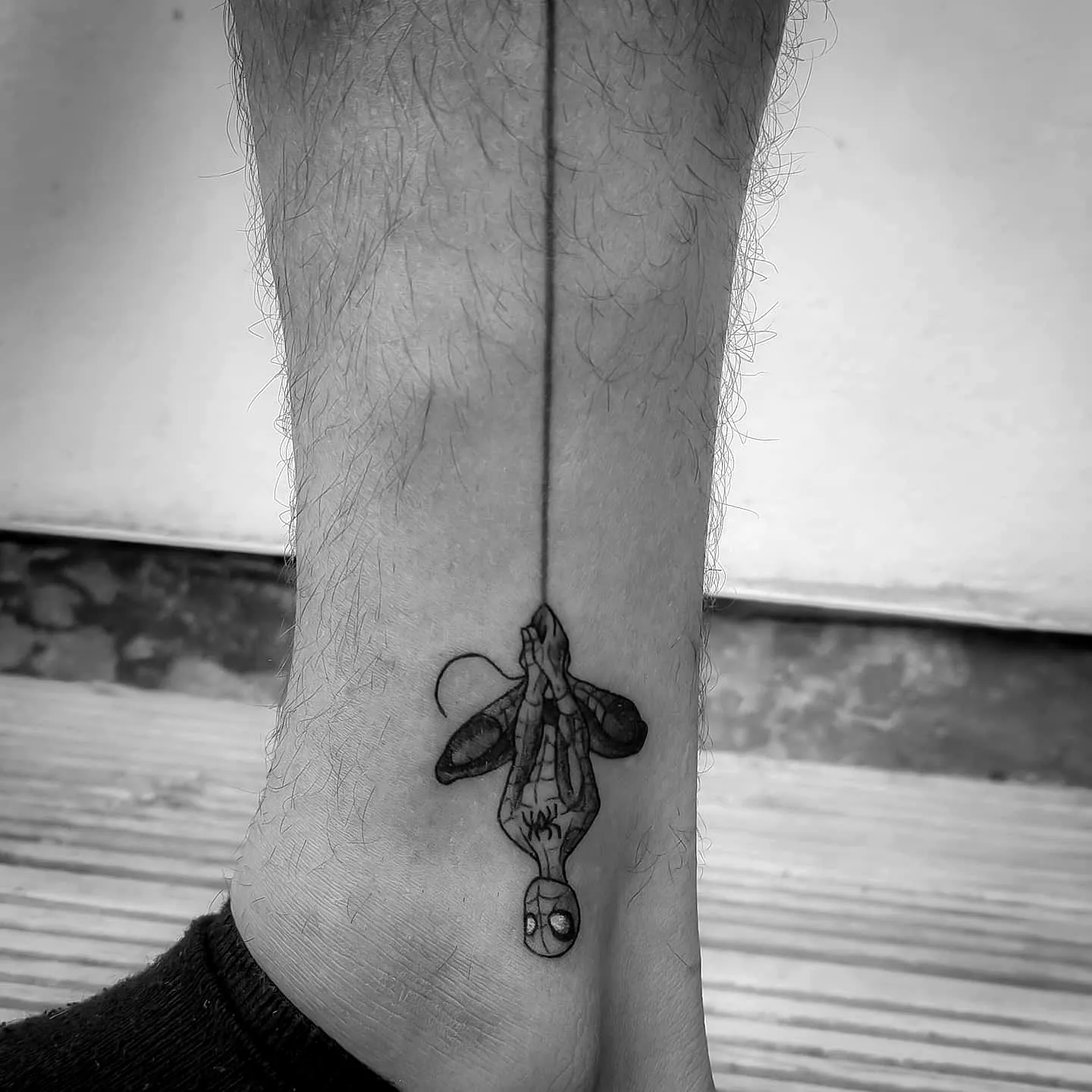 Spider superhero ankle tattoo