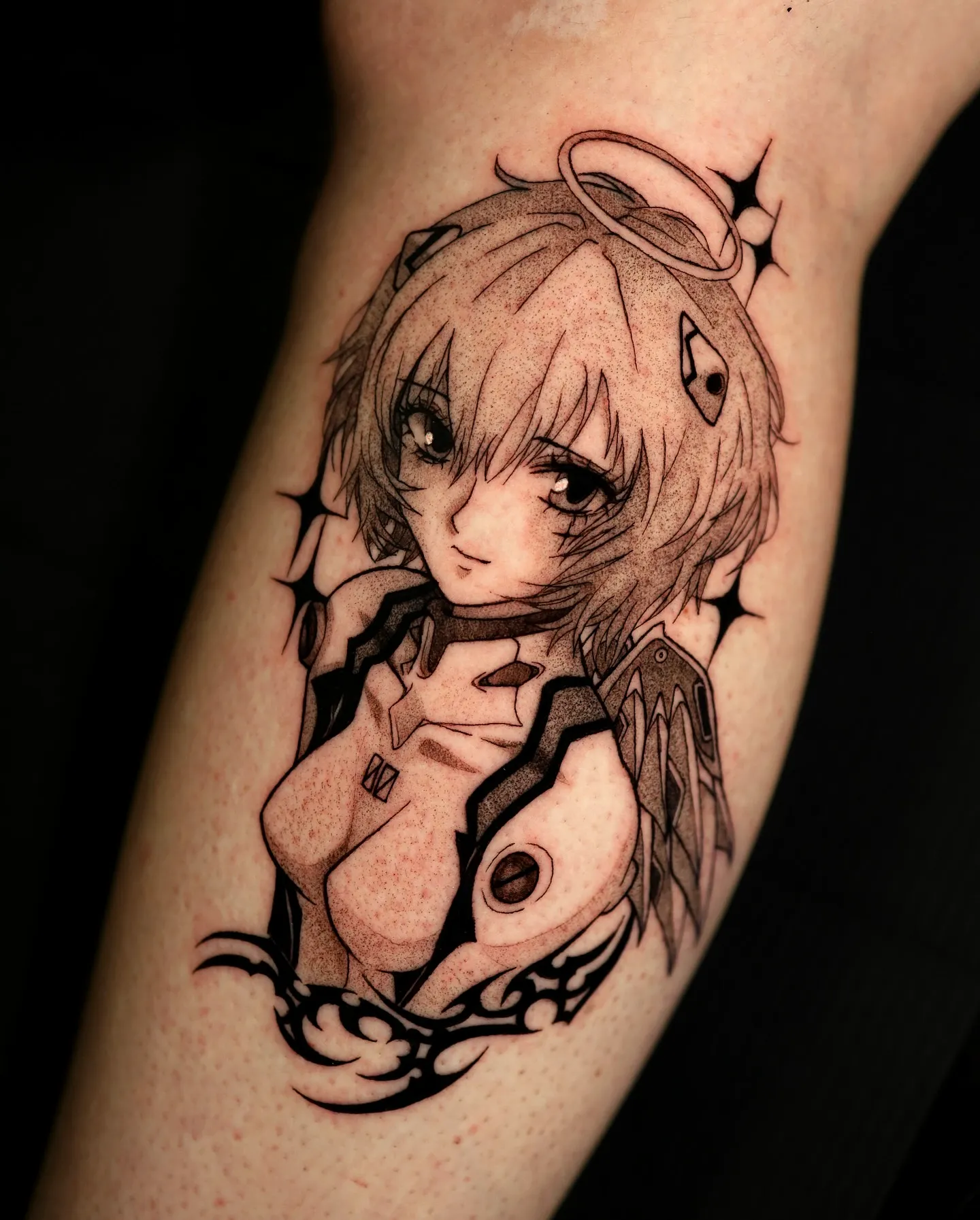 Stylized Angelic Character Arm Tattoo