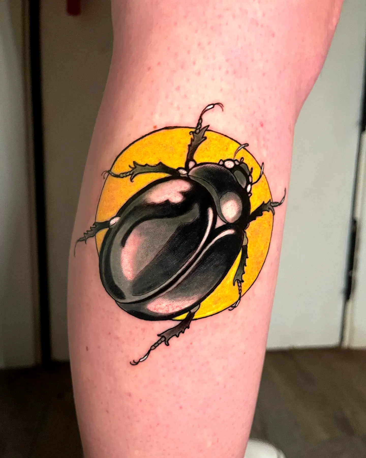 Stylized Beetle Lower Leg Tattoo