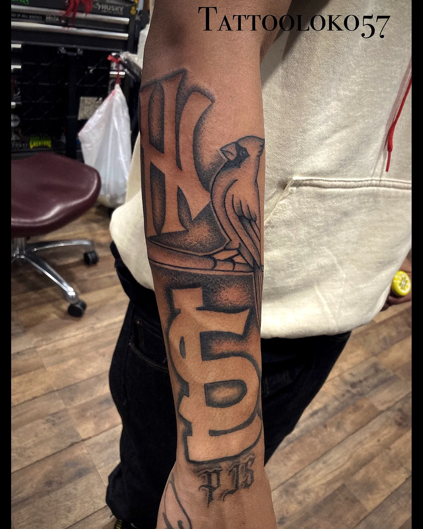 Stylized Bird Forearm Tattoo