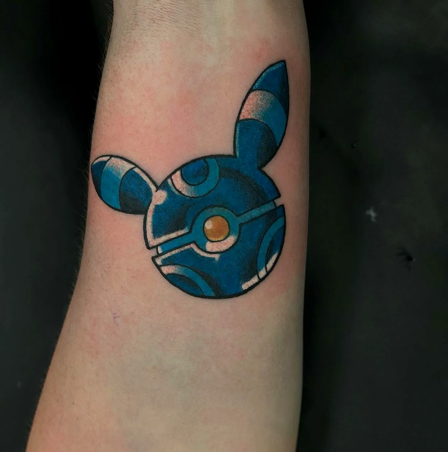 Stylized Blue Poke Ball Forearm Tattoo