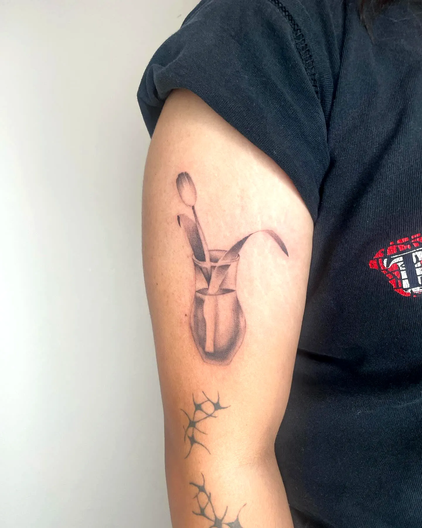 Stylized Coffee Pot Upper Arm Tattoo