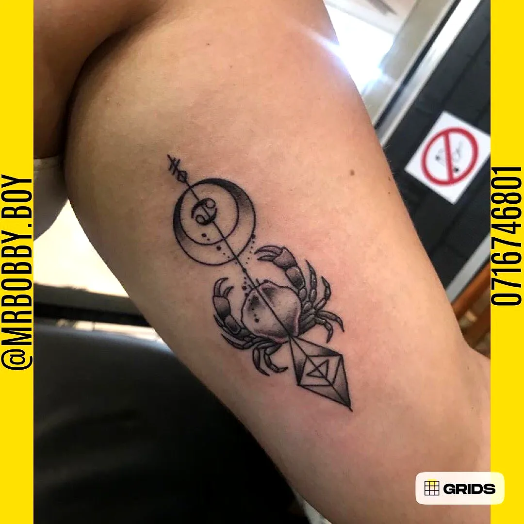 Stylized Crab Upper Arm Tattoo