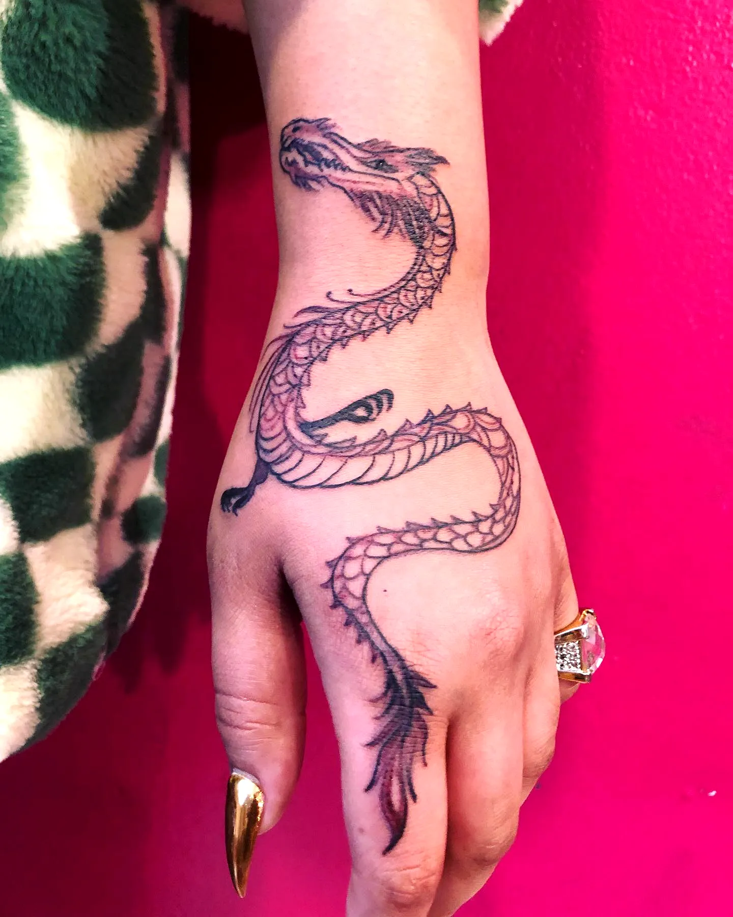 Stylized Dragon Hand Tattoo with Scales
