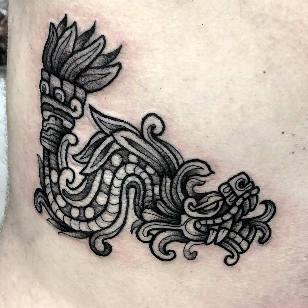 Stylized Dragon Side Tattoo in Black Ink