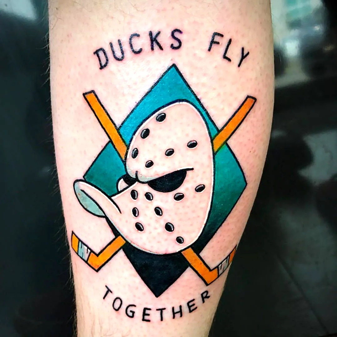 Stylized Duck Mask Arm Tattoo