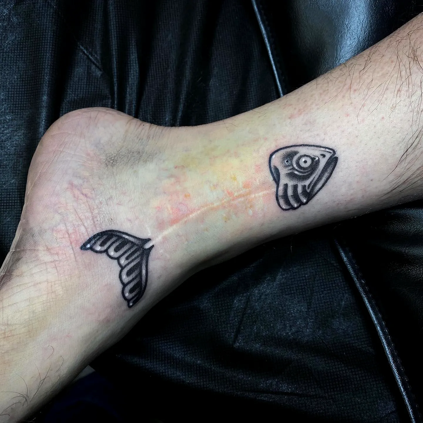 Stylized Fish Ankle Tattoo in Black and Gray