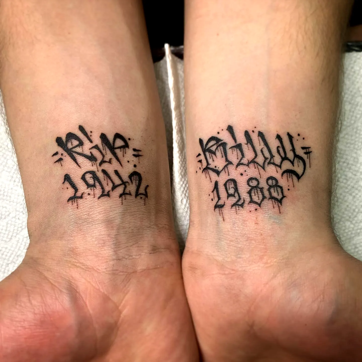 Stylized Graffiti Wrist Tattoos