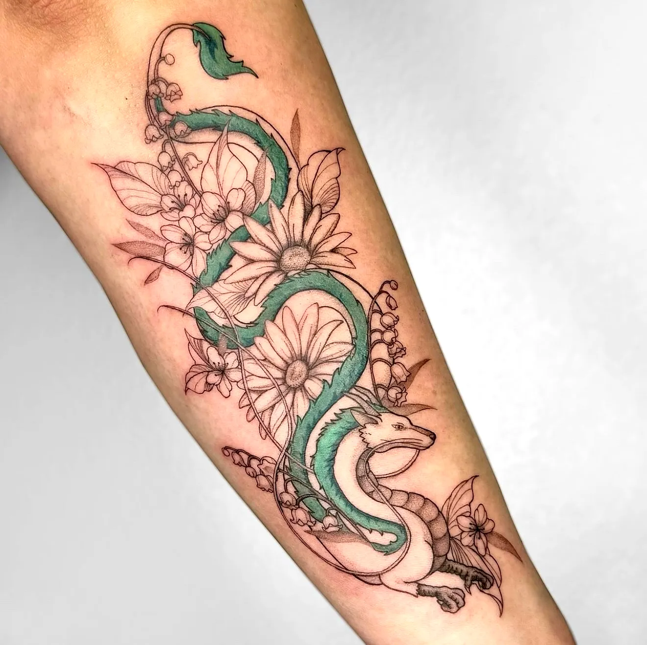 Stylized Green Snake Forearm Tattoo