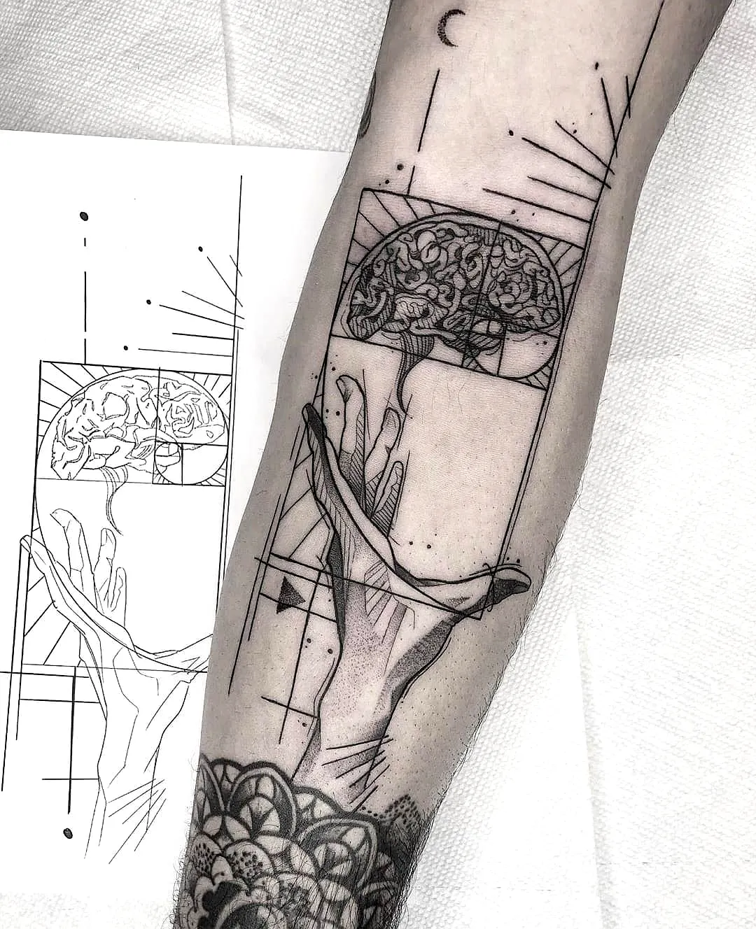 Stylized Hand Brain Tattoo Design