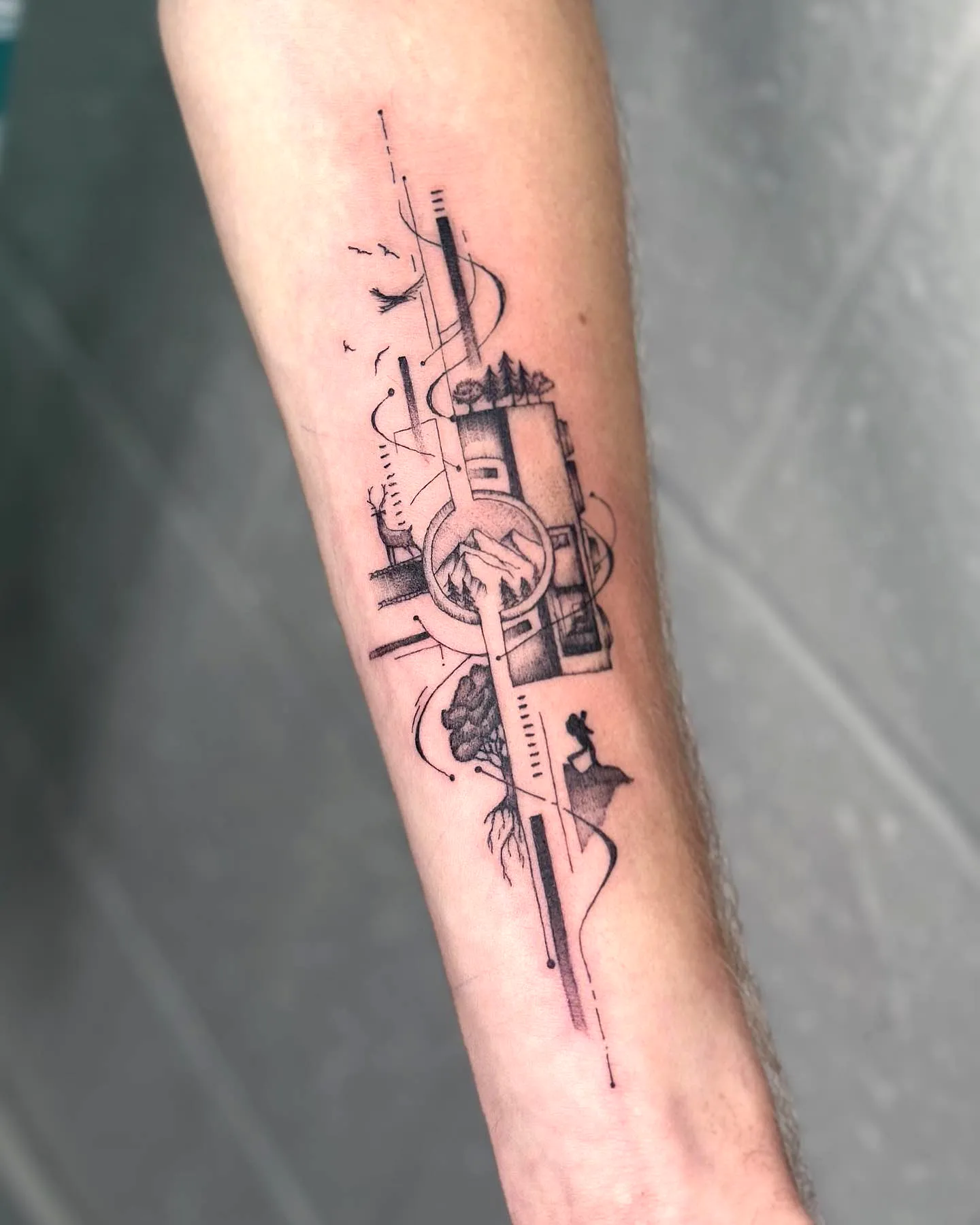 Stylized Landscape Forearm Tattoo