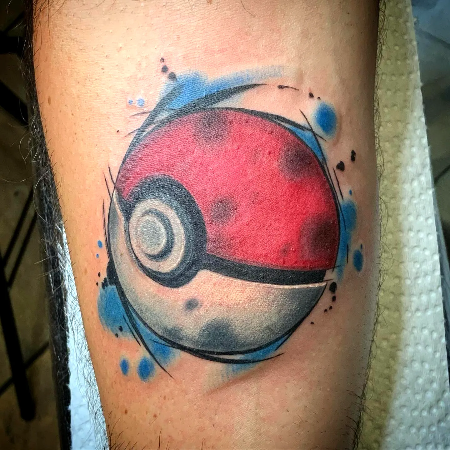 Stylized Poke Ball Forearm Tattoo