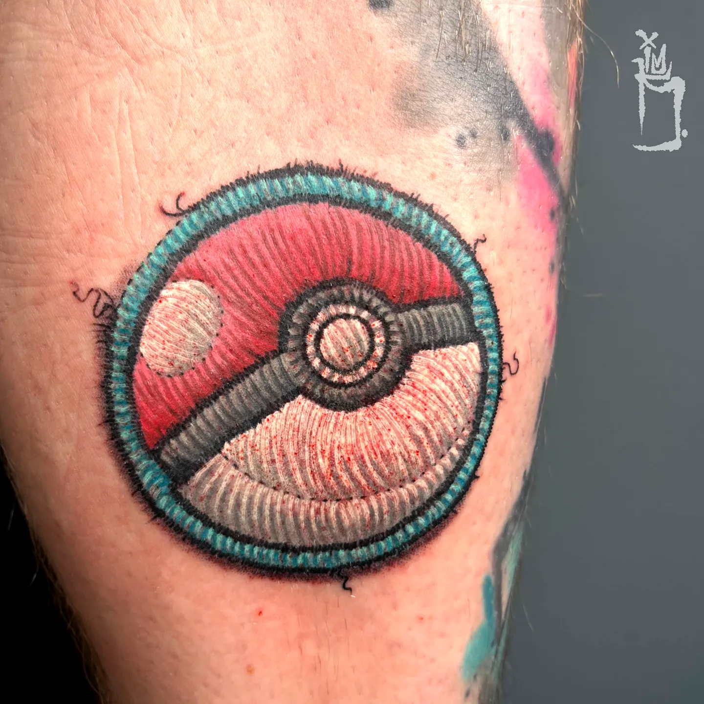 Stylized Poke Ball Forearm Tattoo