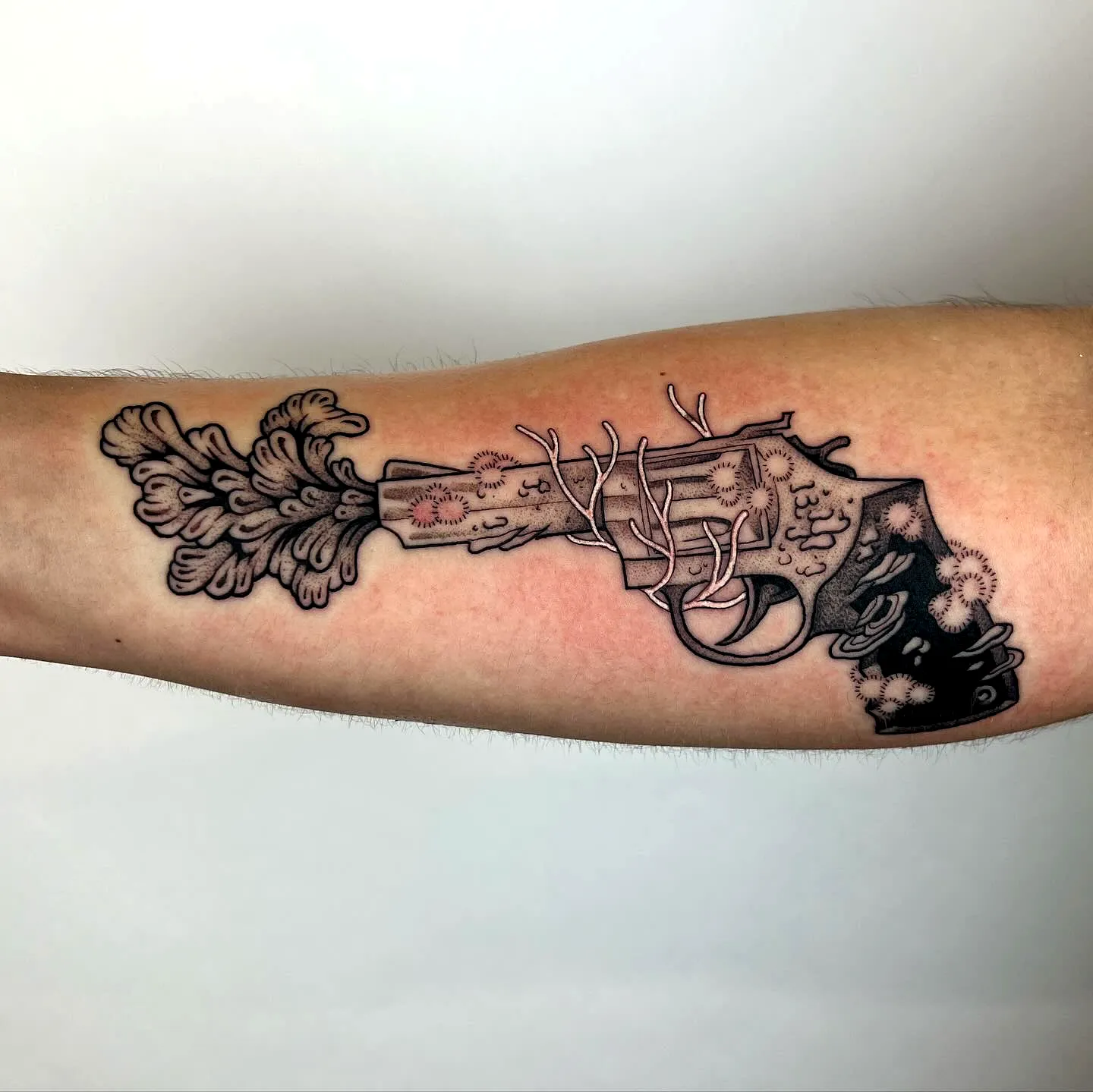 Stylized Revolver Forearm Tattoo