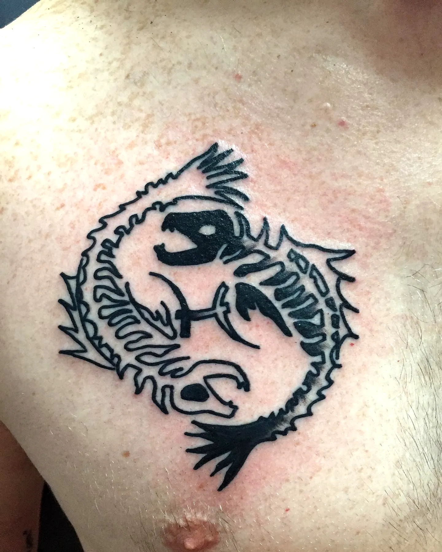 Stylized Scorpion Chest Tattoo