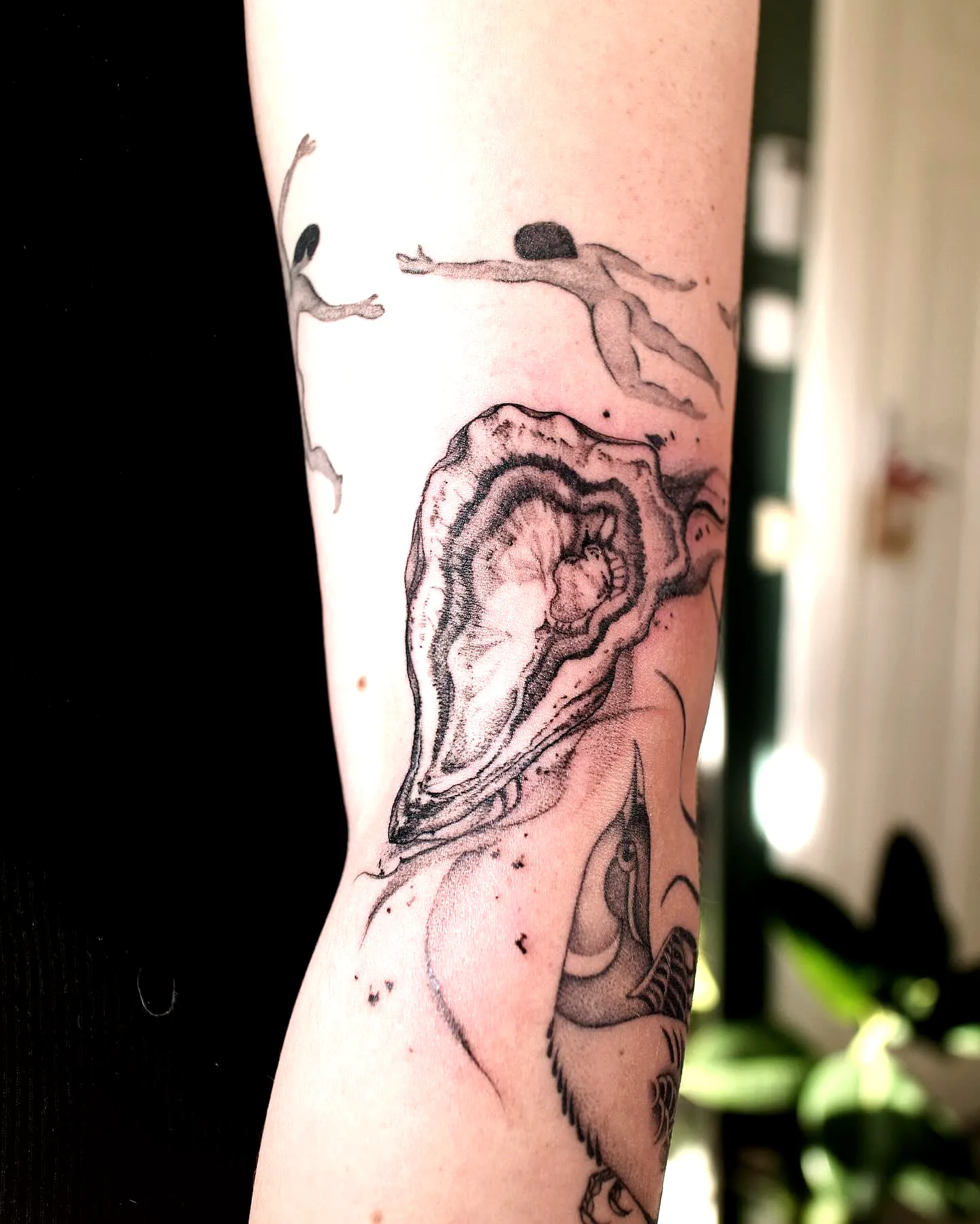 Stylized Shell Arm Tattoo