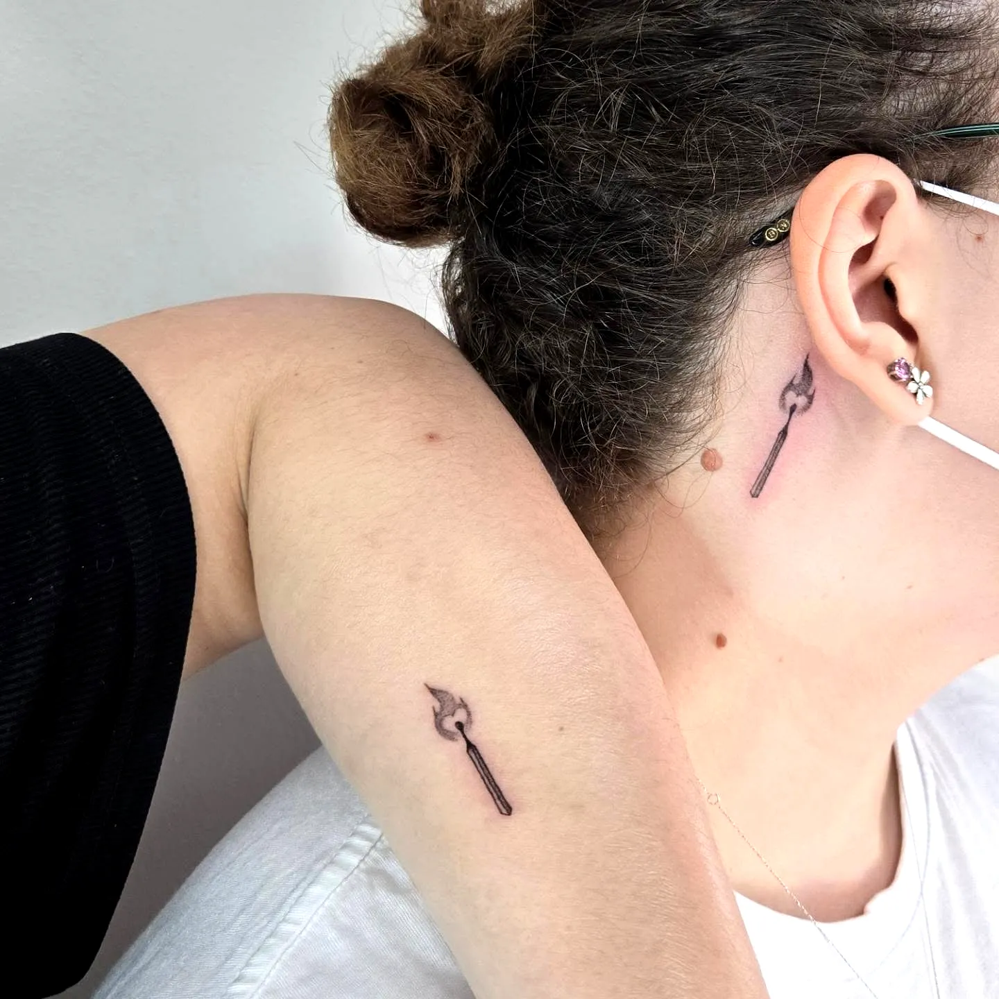 Stylized Spearhead Neck Tattoo