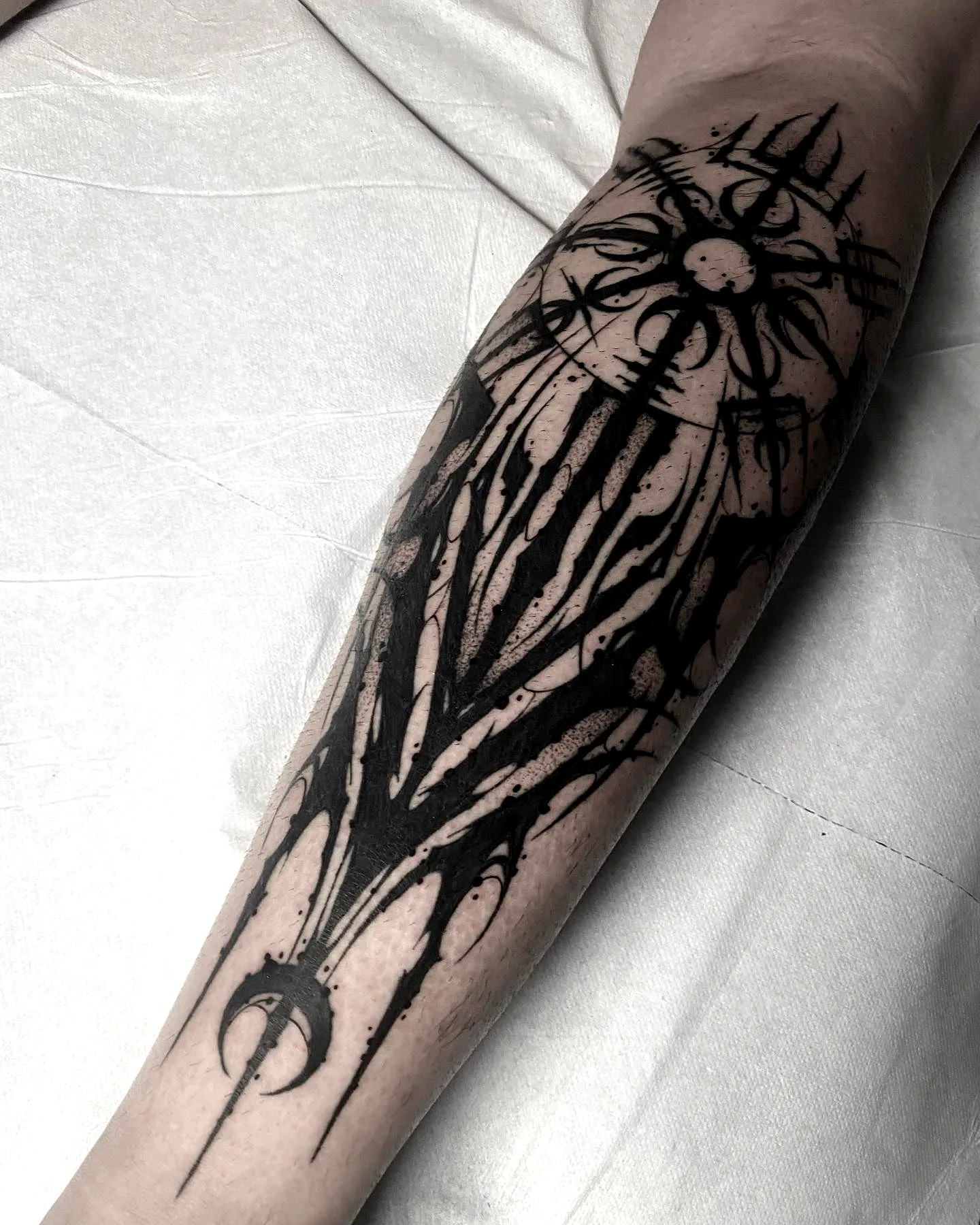 Sun Forearm Tattoo with Abstract Shapes