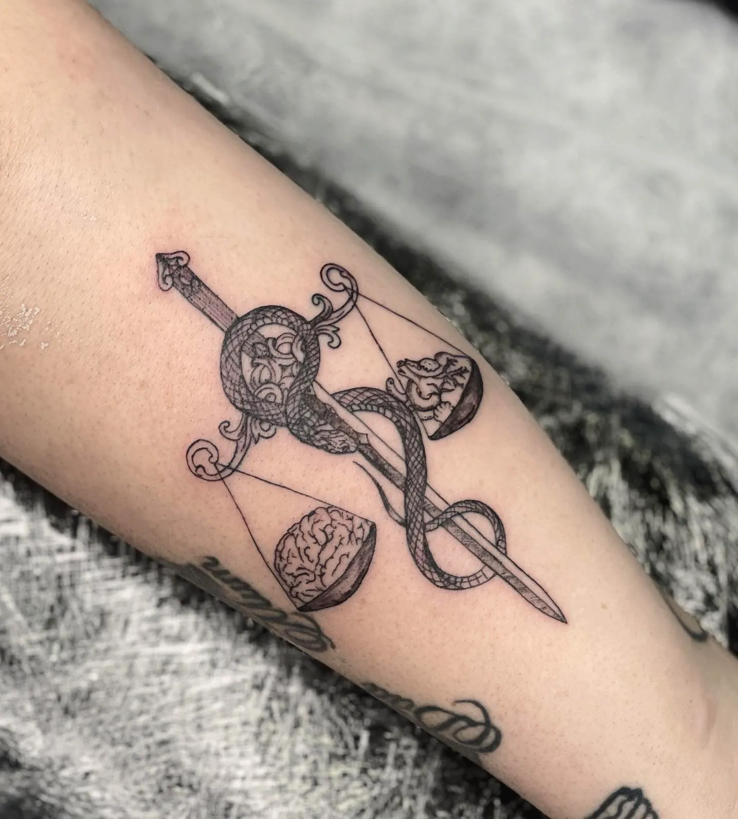 Sword and Snake Forearm Tattoo