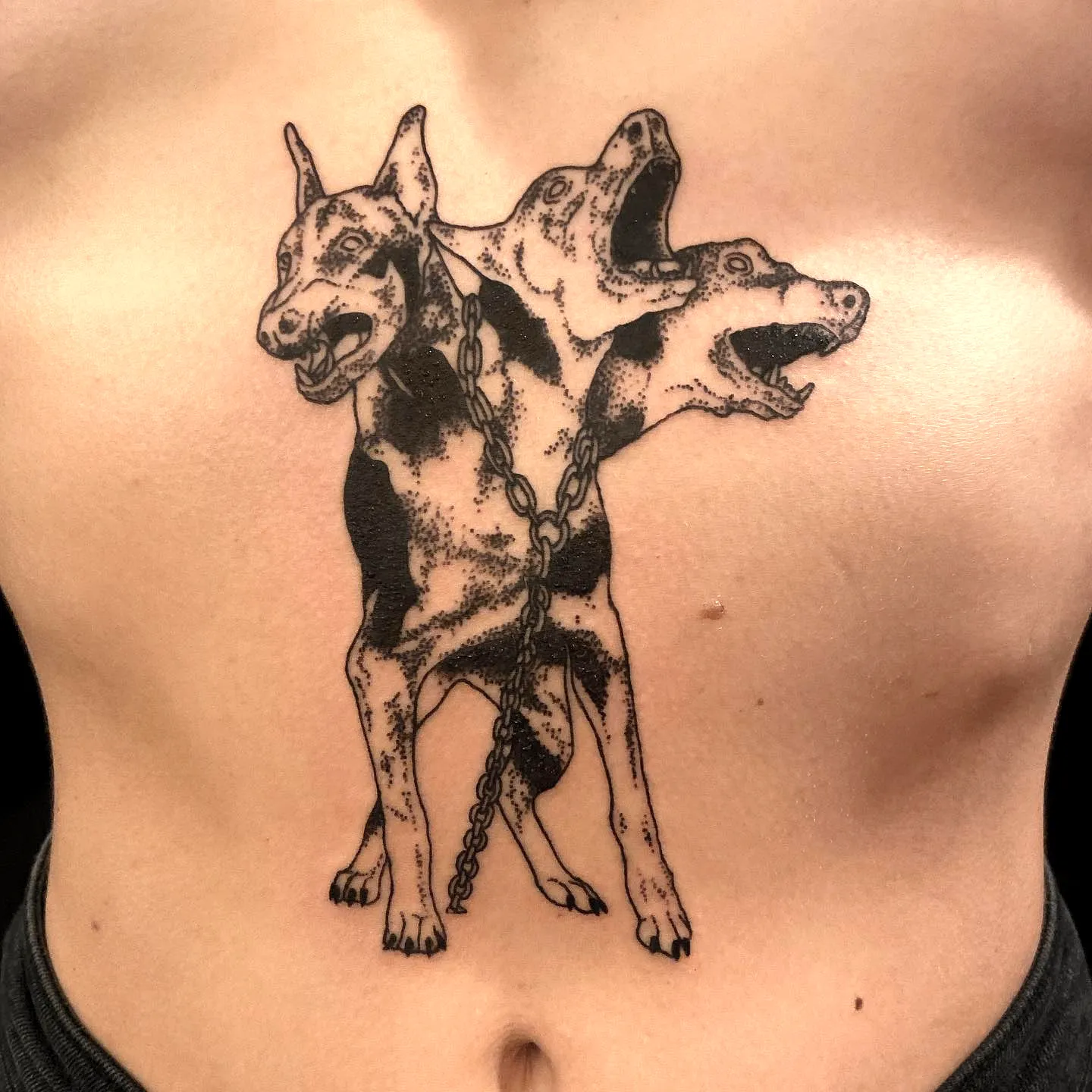 Three-Headed Cerberus Chest Tattoo