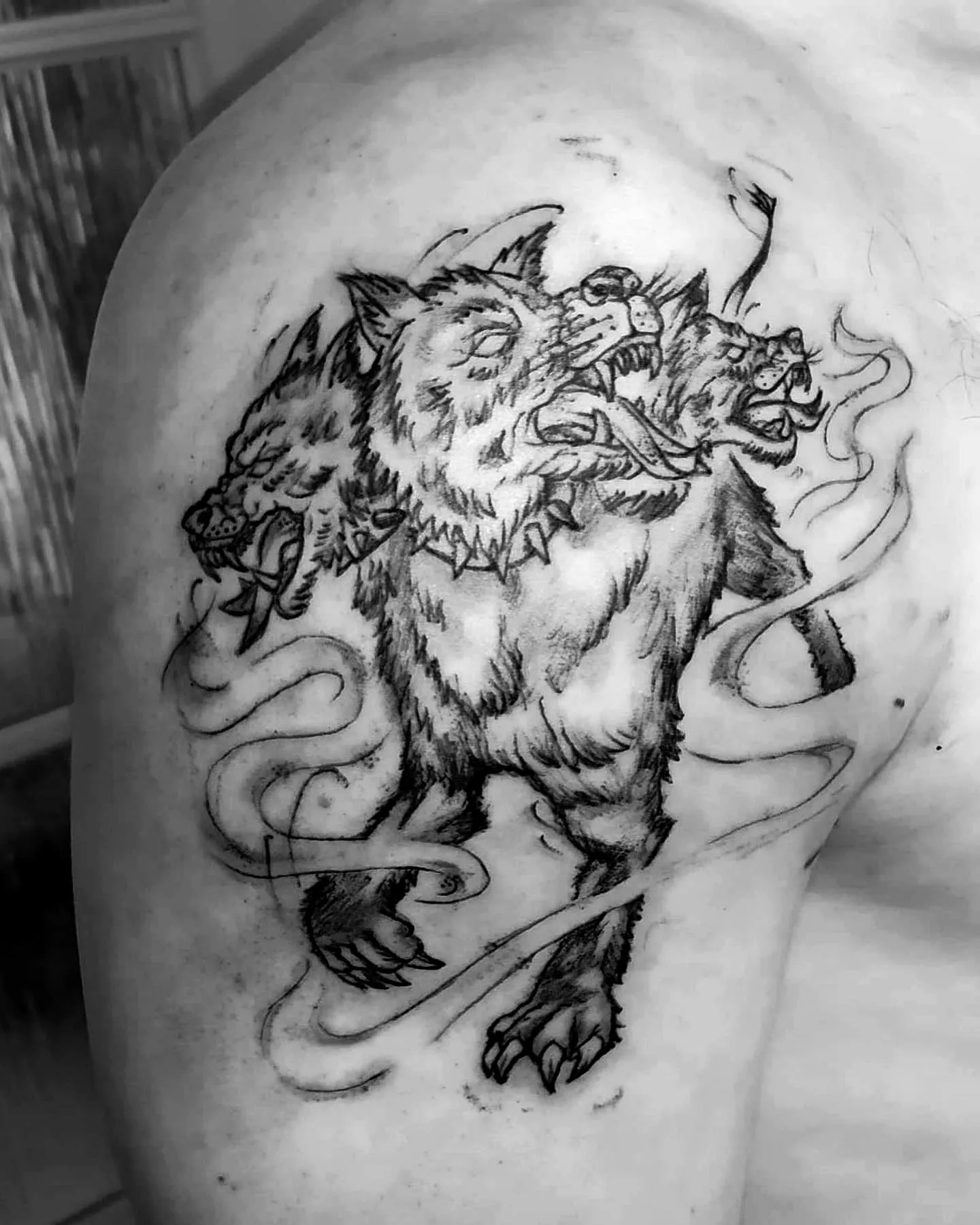 Three-Headed Wolf Upper Arm Tattoo