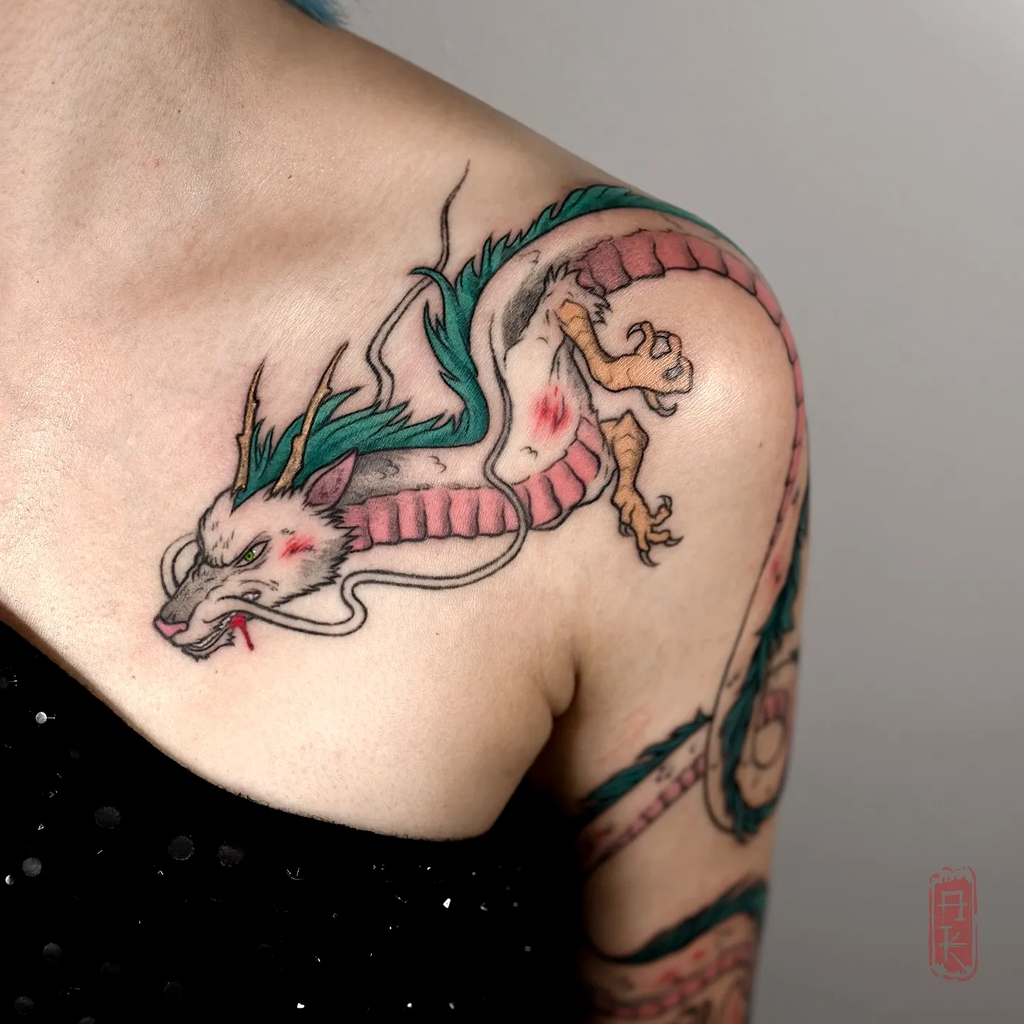 Vibrant Dragon Shoulder Tattoo