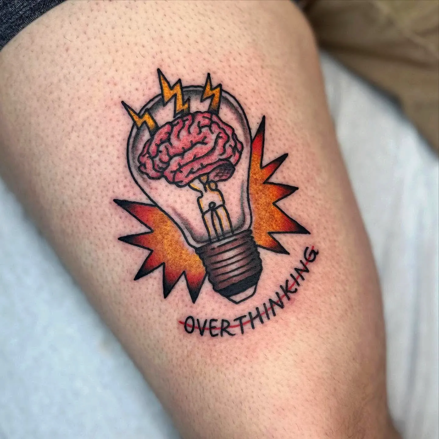 Vibrant Light Bulb Thigh Tattoo