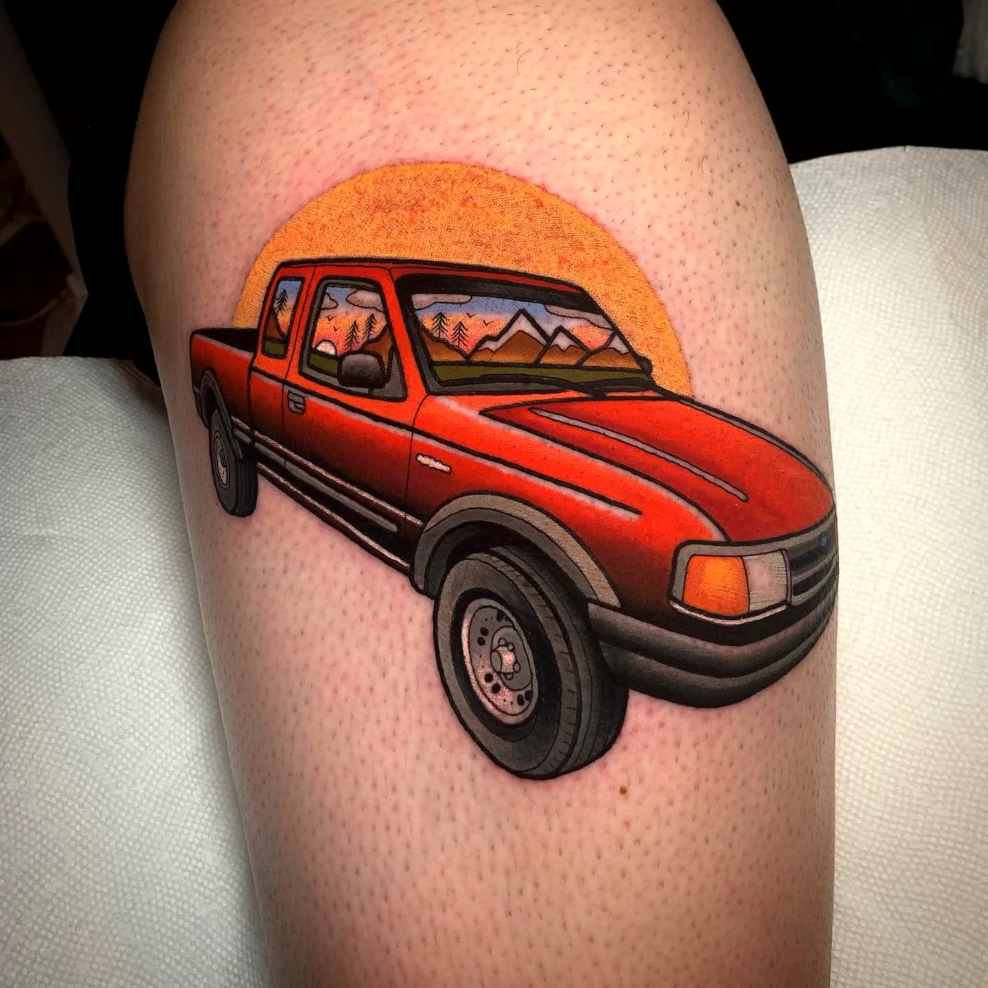 Vibrant Red Truck Thigh Tattoo