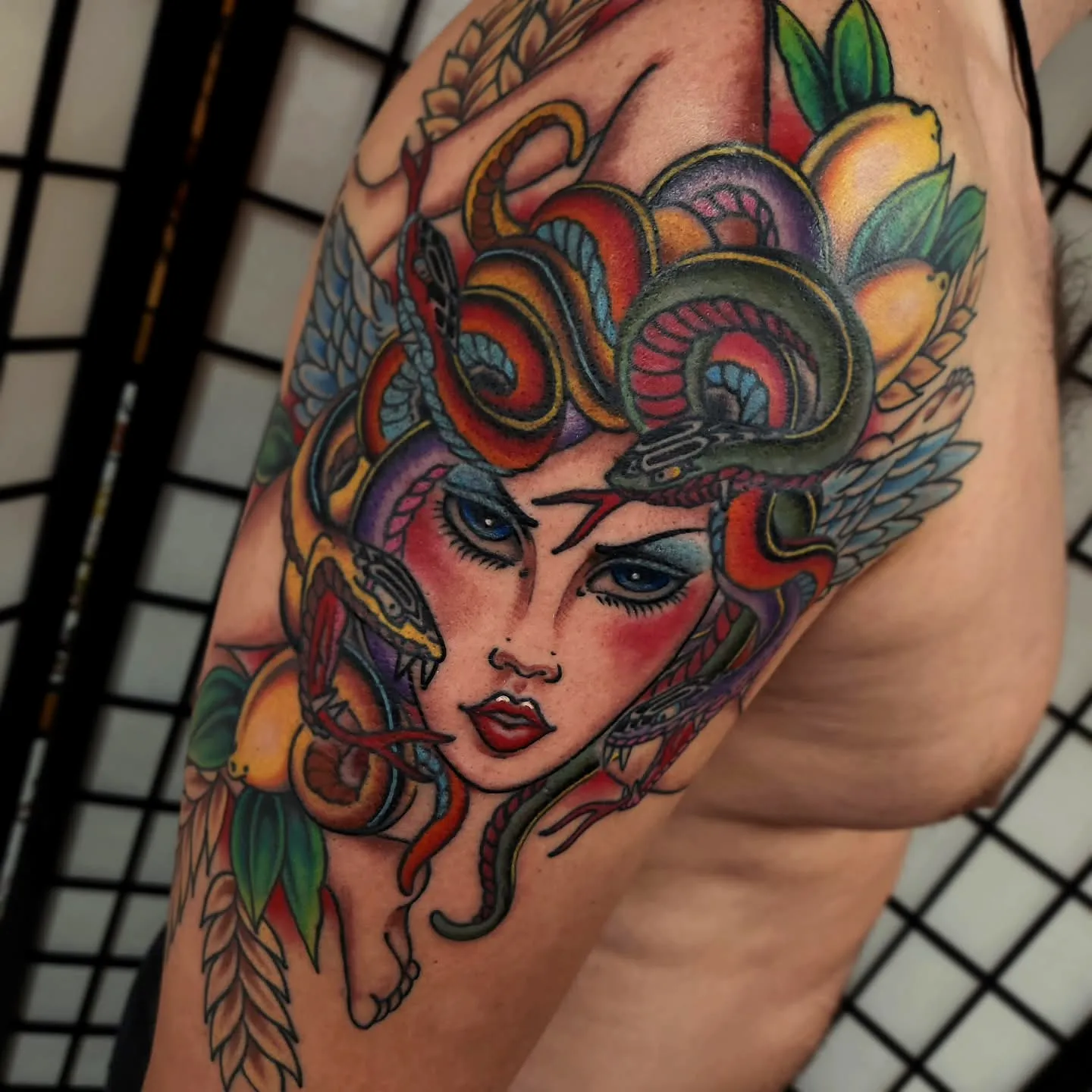Vibrant Womans Face Upper Arm Tattoo