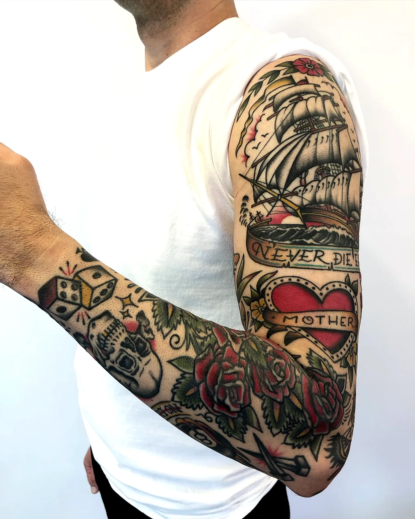 Vintage ship sleeve tattoo with roses