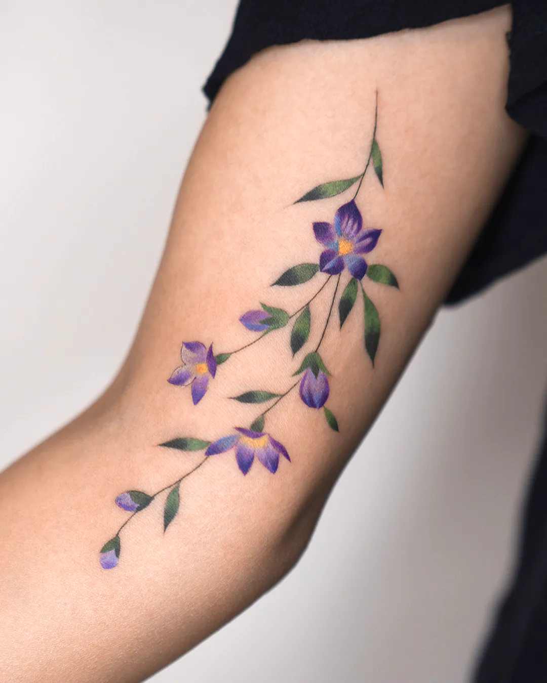 Violet Flower Vine Forearm Tattoo