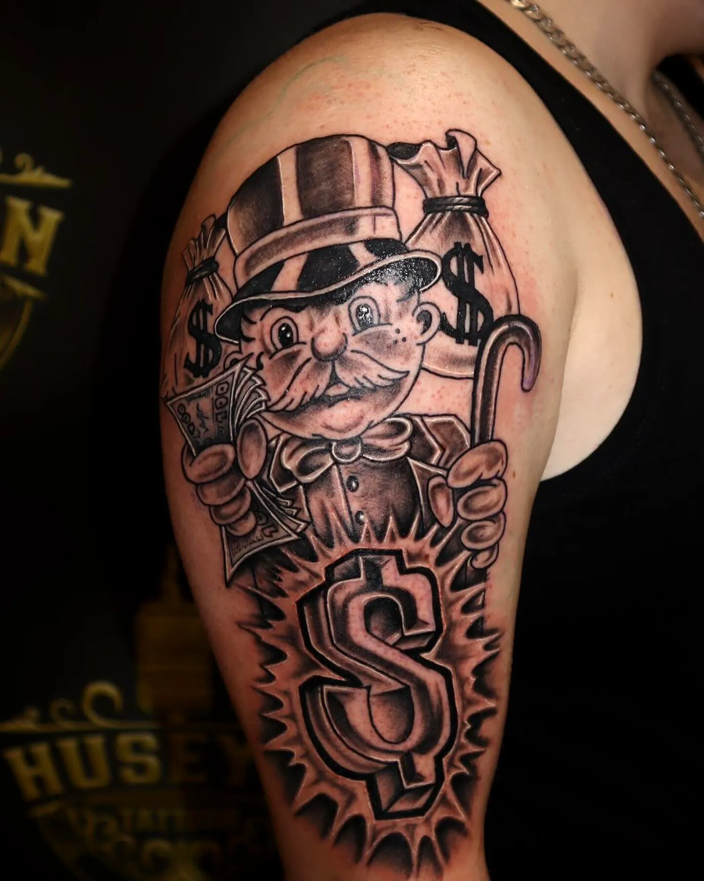 Wealthy Man Arm Tattoo in Black and Gray